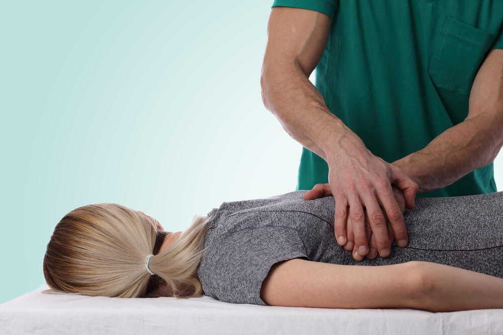 Joint mobilization for treating spine pain in St. Louis, MO shutterstock 580504438 spine mobilization