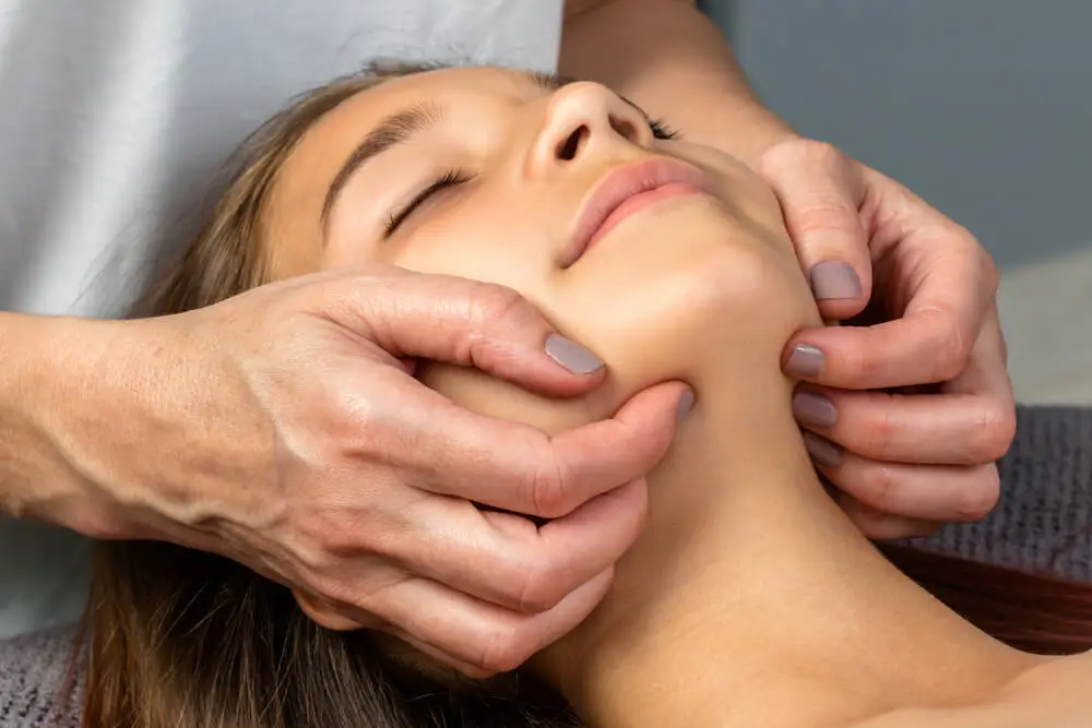 TMJ pain treatment from physical therapists in Kentwood, MI shutterstock 662507725 tmj massage tmj pain treatment