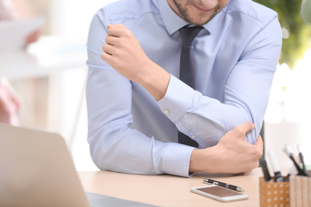 Three tennis elbow from typing treatments in Ellisville, MO shutterstock 1063893257 tennis elbow from typing
