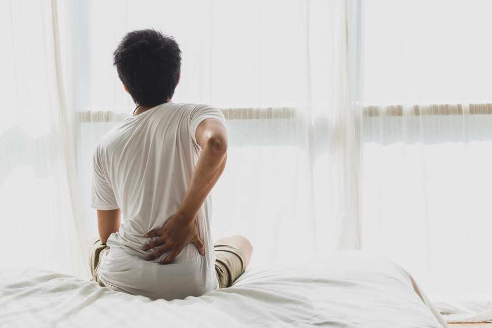 Pain at the base of your spine? Here’s what might be causing it