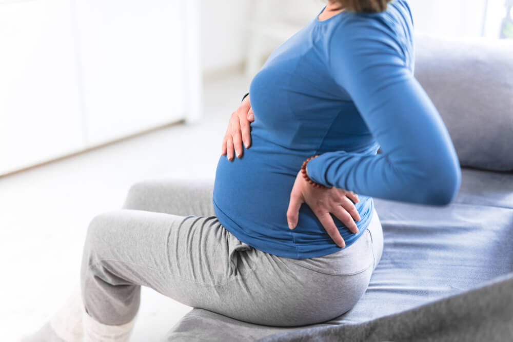 Is it normal to have lower back pain in the early stages of pregnancy? shutterstock 1588563721 is lower back pain normal in the early stages of pregnancy?