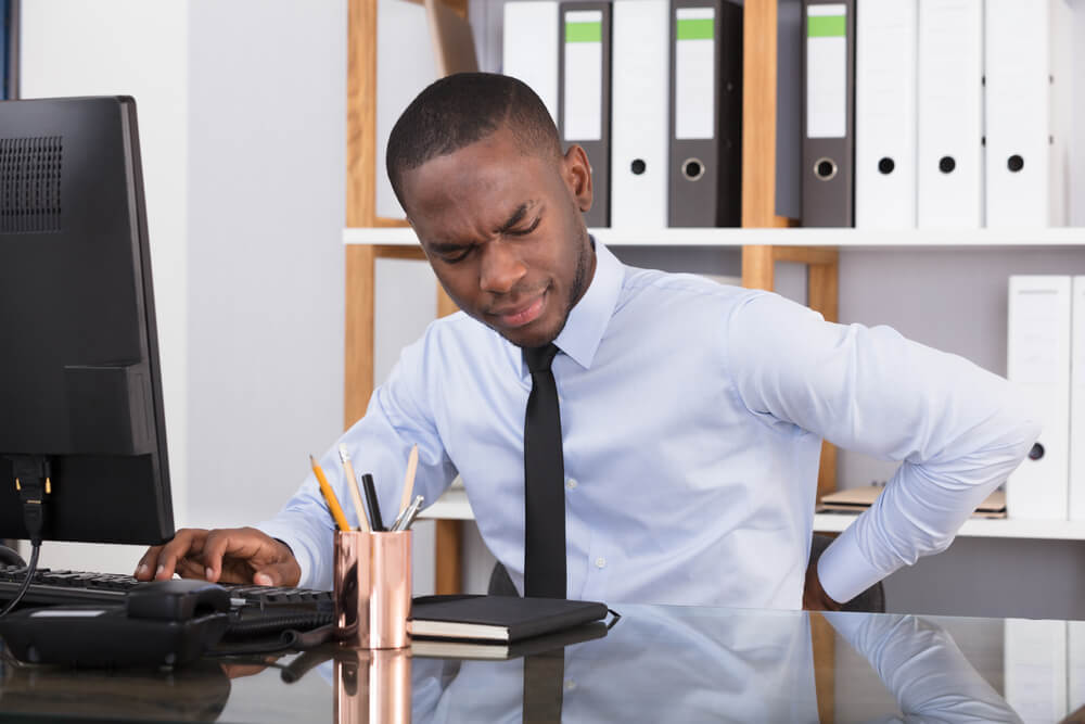 Why do I experience pain when sitting? shutterstock 762123748 pain when sitting