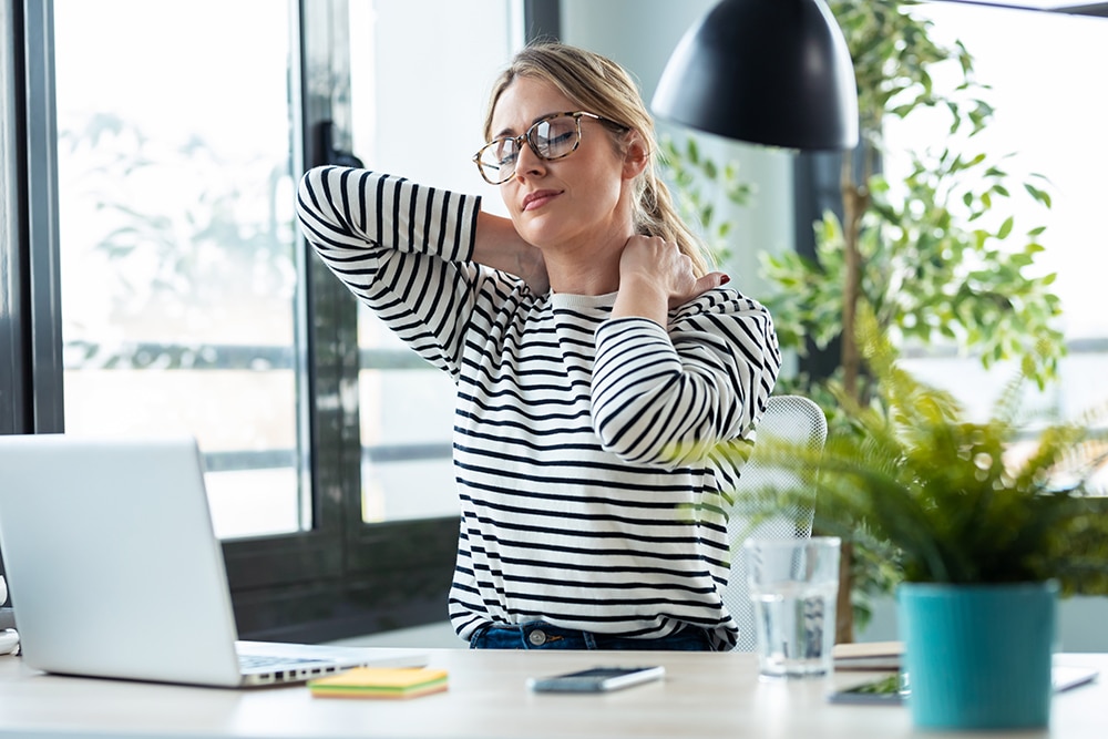 4 causes of sore front neck muscles tired mature business woman with neck pain looking 2022 12 15 18 13 33 utc 4 causes of sore front neck muscles neck pain
