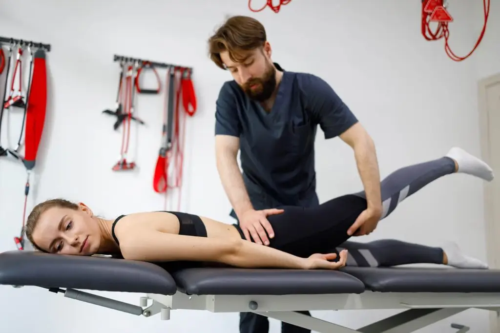 Hip, knee and ankle pain in one leg: What could it be? female patient on physical therapy manual therapi 2022 10 03 20 43 43 utc hip knee and ankle pain in one leg