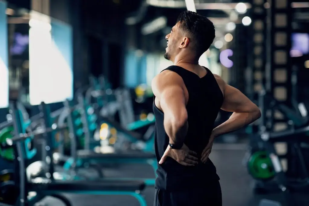 What causes lower back pain in females specifically? portrait of young arab bodybuilder suffering lower 2022 12 16 06 39 37 utc achiness