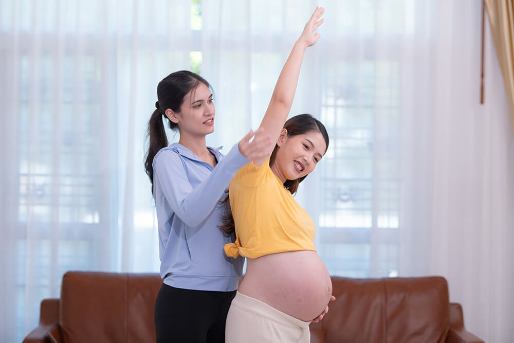 What might be causing my shoulder pain during pregnancy? happy asian pregnant woman with yoga teacher teach 2023 12 19 20 10 39 utc what might be causing my shoulder pain during pregnancy? shoulder pain