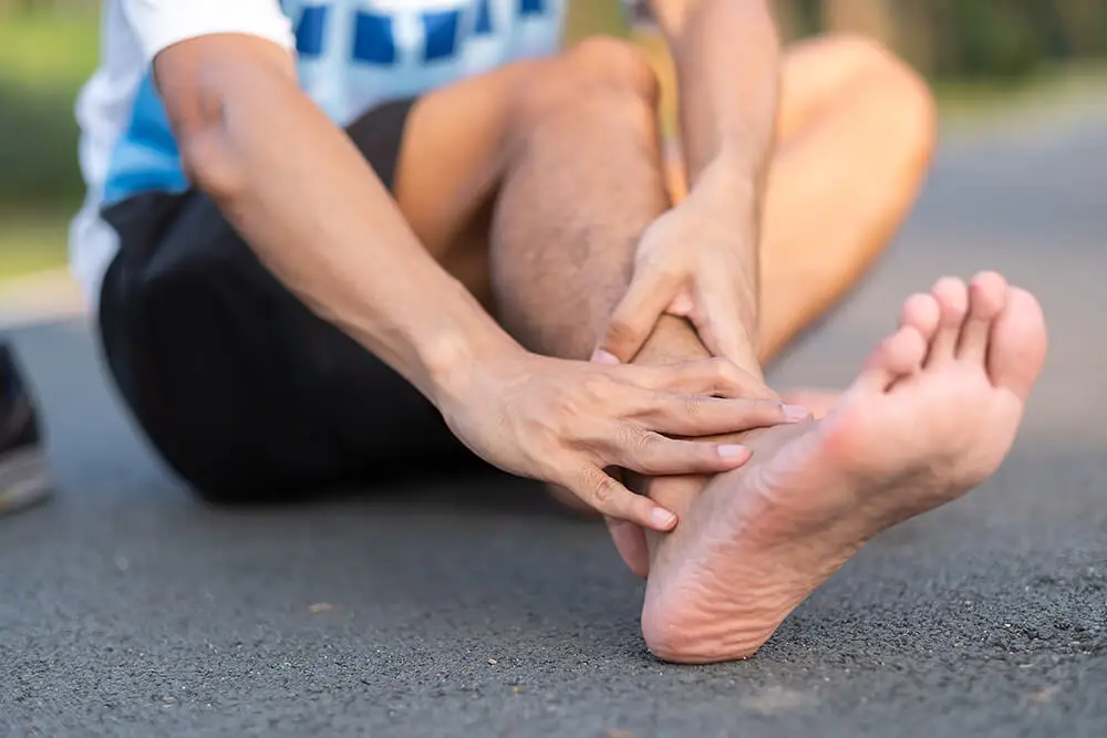 3 PT treatments for a sprained ankle that's also causing knee pain young fitness man holding his sports leg injury 2023 11 27 05 11 29 utc 3 pt treatments for a sprained ankle that's also causing knee pain ankle pain