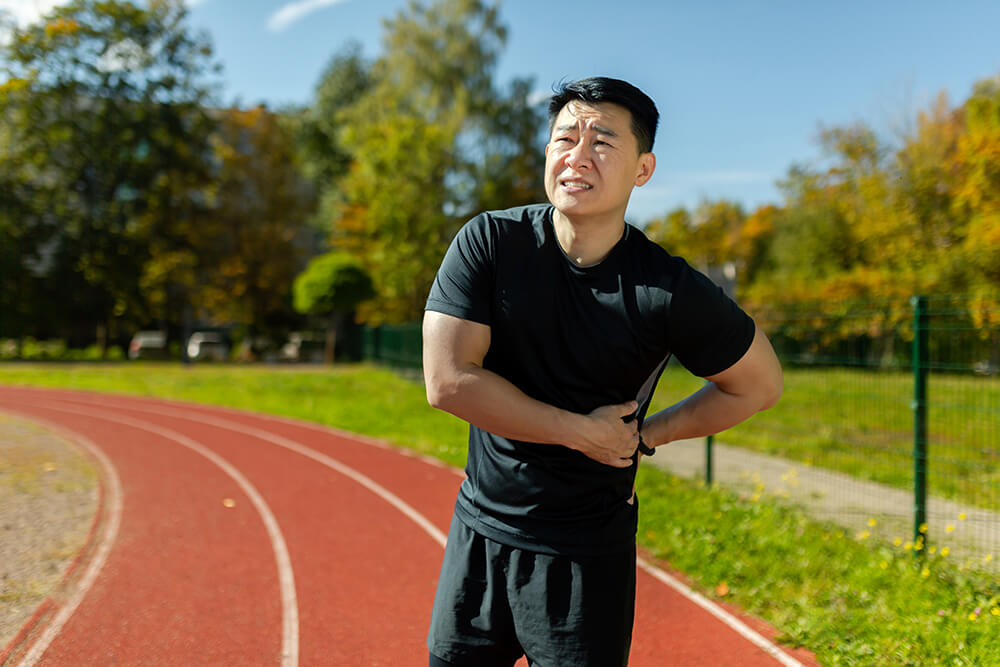 4 common types of soft tissue injury and how PT can help them asian sportsman has severe pain in back and abdomi 2023 11 27 05 14 27 utc 4 common types of soft tissue injury and how pt can help them physical therapy