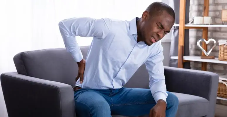 Back hurts when you sneeze? Here's why and what to do about it shutterstock 1233427069 back hurts when you sneeze? here's why and what to do about it back pain
